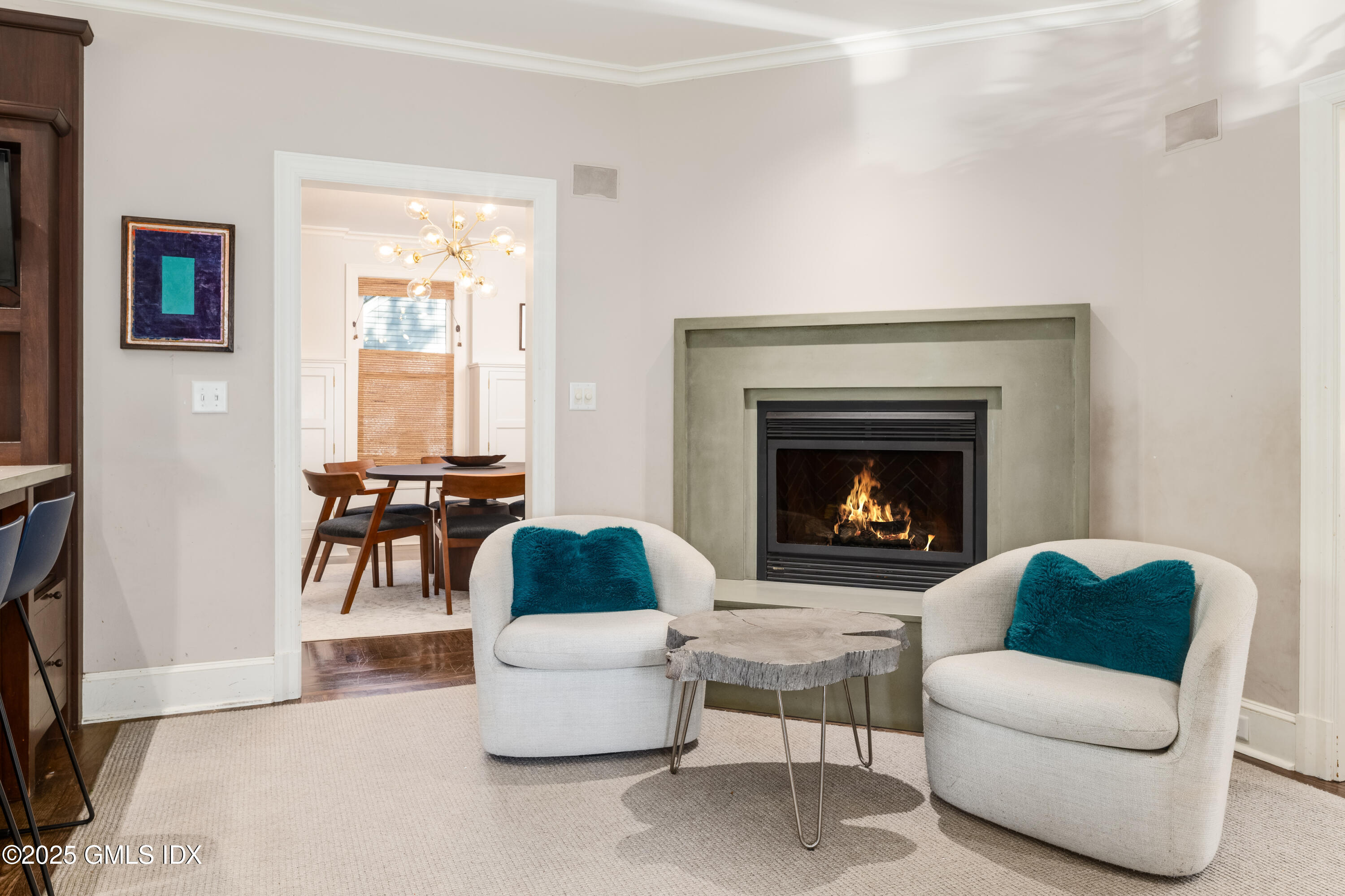 76 Sinawoy Road Cos Cob, CT 06807 - Photo 9 of 23 a living room with furniture and a fireplace