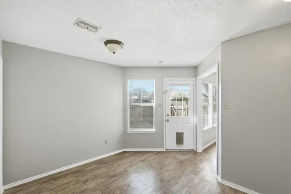 a view of an empty room with a window