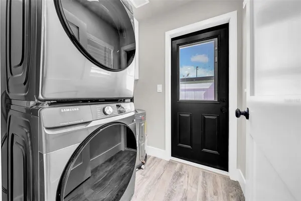 a view of a hallway with washer and dryer