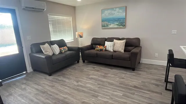 a living room with furniture and a window