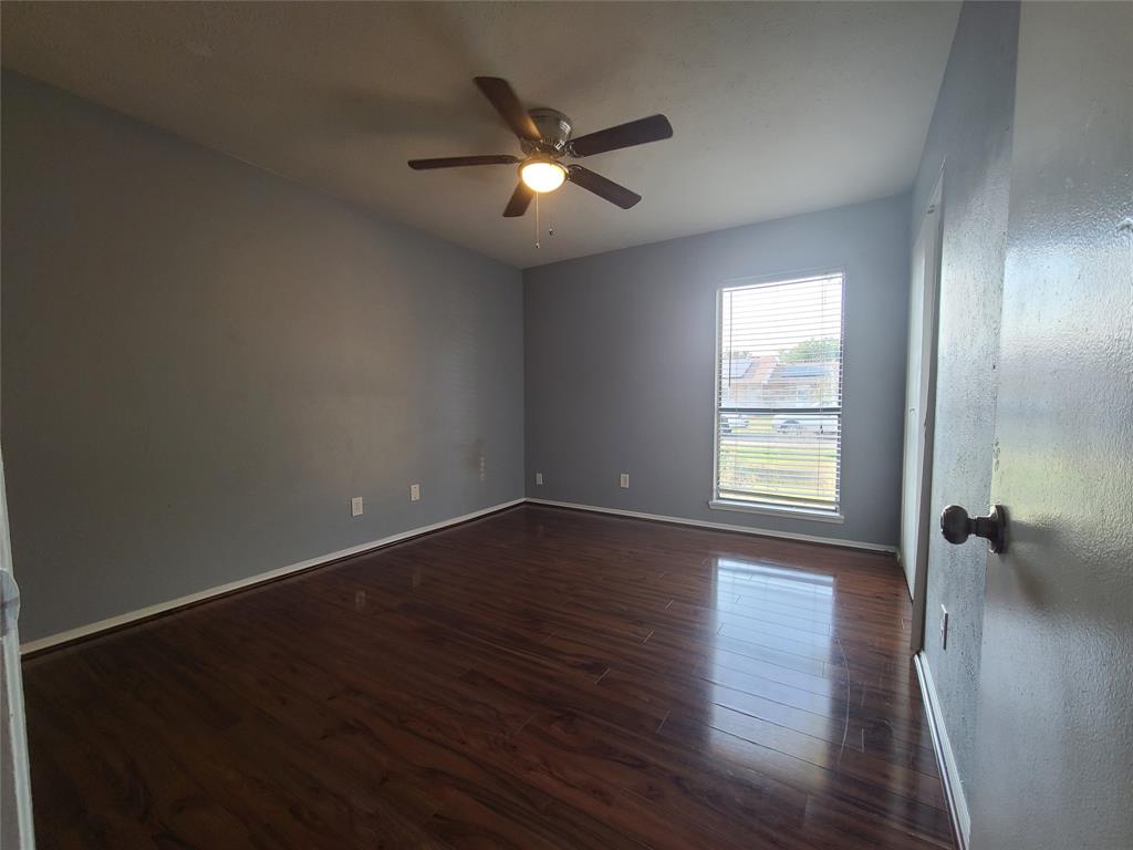 5644 Perrin Street The Colony, TX 75056 - Photo 10 of 16 Unfurnished room featuring dark hardwood / wood-style flooring and ceiling fan