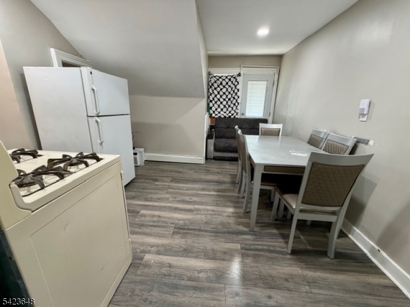 356 Pacific Street, Unit 3 Paterson, NJ 07503 - Photo 11 of 11 a workspace with furniture and a table