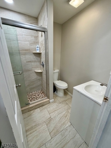 356 Pacific Street, Unit 3 Paterson, NJ 07503 - Photo 5 of 11 a bathroom with a shower and toilet