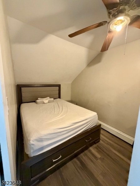 356 Pacific Street, Unit 3 Paterson, NJ 07503 - Photo 7 of 11 a bed sitting in a bedroom next to a window