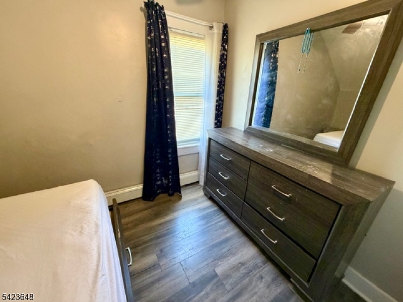 356 Pacific Street, Unit 3 Paterson, NJ 07503 - Photo 8 of 11 a view of bedroom with wooden floor