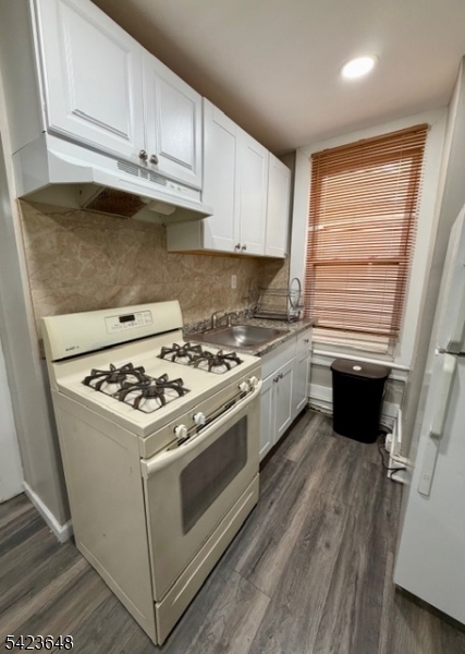356 Pacific Street, Unit 3 Paterson, NJ 07503 - Photo 10 of 11 a white stove top oven sitting inside of a kitchen