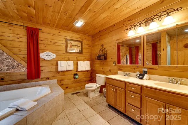 a spacious bathroom with a double vanity sink and a mirror