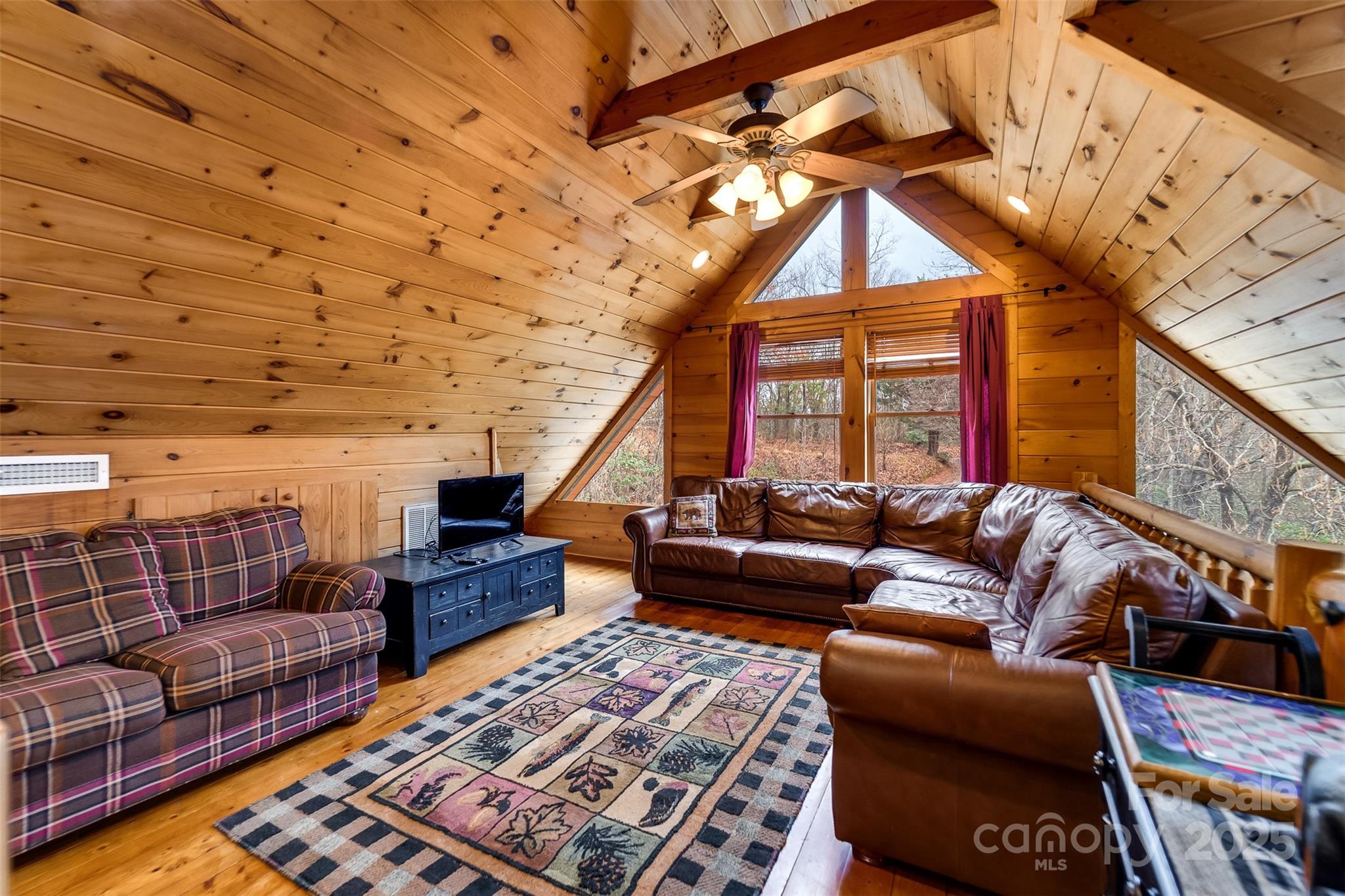 561 Signal Ridge Sylva, NC 28779 - Photo 24 of 48 a living room with furniture a rug and a window
