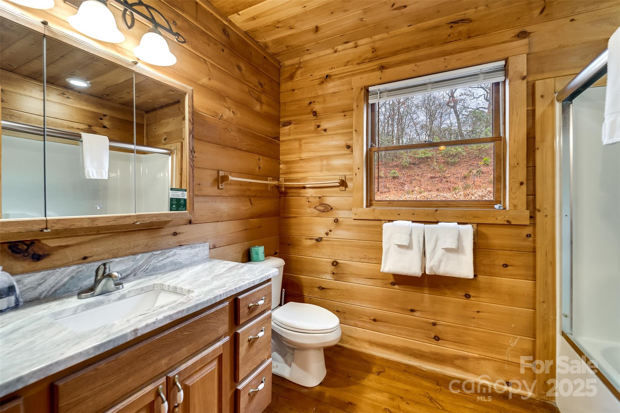 561 Signal Ridge Sylva, NC 28779 - Photo 28 of 48 a bathroom with a granite countertop sink toilet and shower