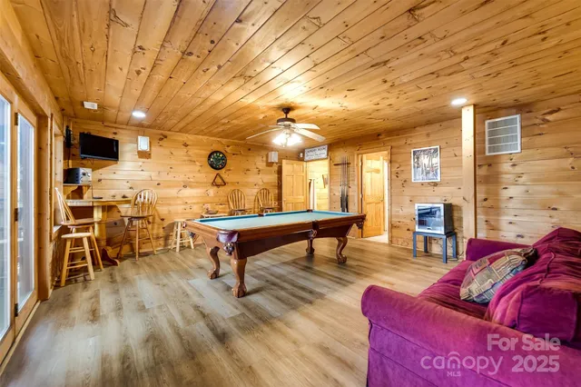 a living room with furniture a wooden floor and a table