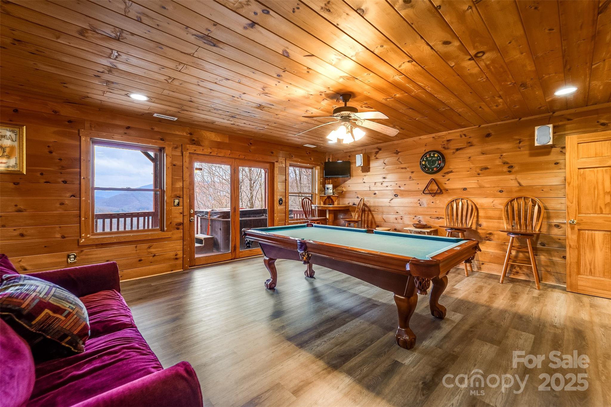 561 Signal Ridge Sylva, NC 28779 - Photo 30 of 48 a living room with furniture a table and wooden floor