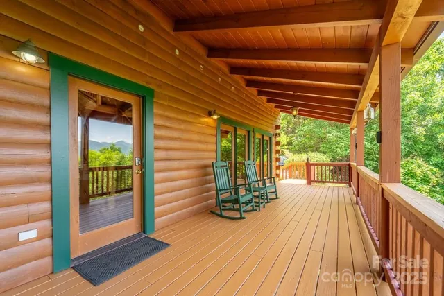 a view of balcony with floor to ceiling window with wooden floor