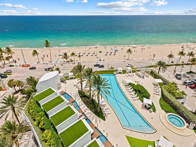 a view of swimming pool with a balcony