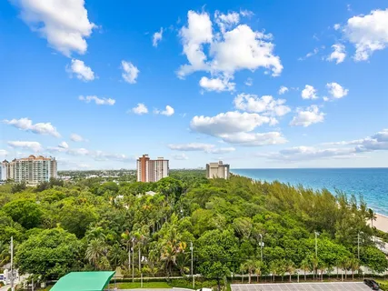 a view of a city with lots of green space