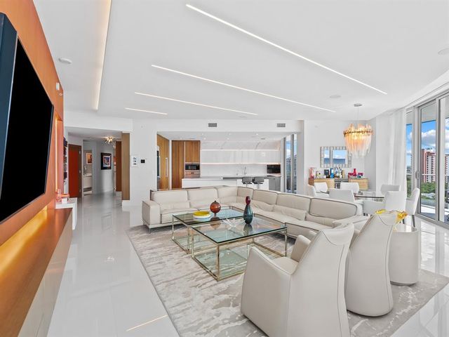 a living room with fireplace furniture and a flat screen tv