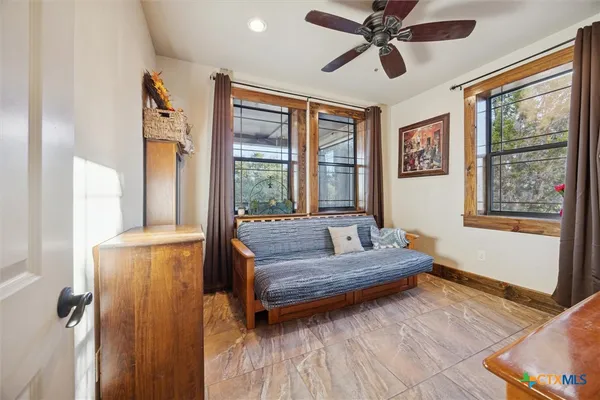 a living room with furniture and a large window