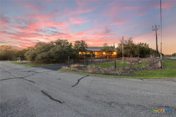 a view of a road with a yard