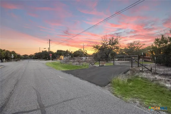 a view of a road with a yard