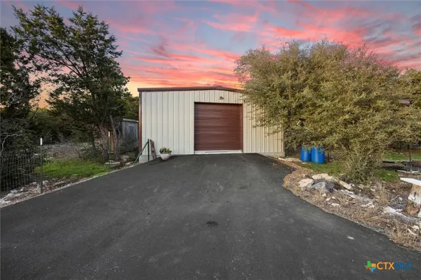 a view of backyard and tree