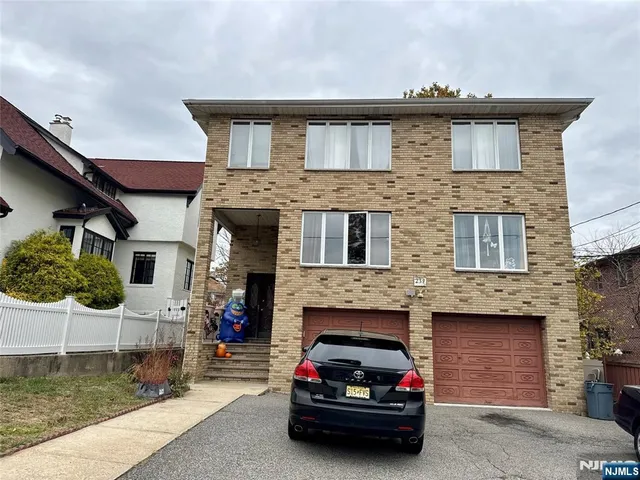 a car parked in front of a house