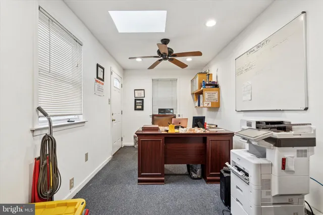 a view of a workspace with furniture