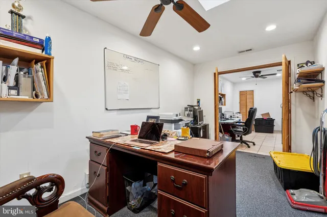 a view of a workspace with furniture