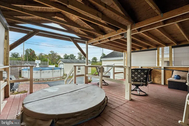 a view of a balcony dining area with furniture