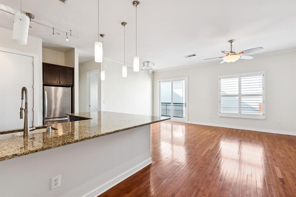 a view of a kitchen with a sink and a window
