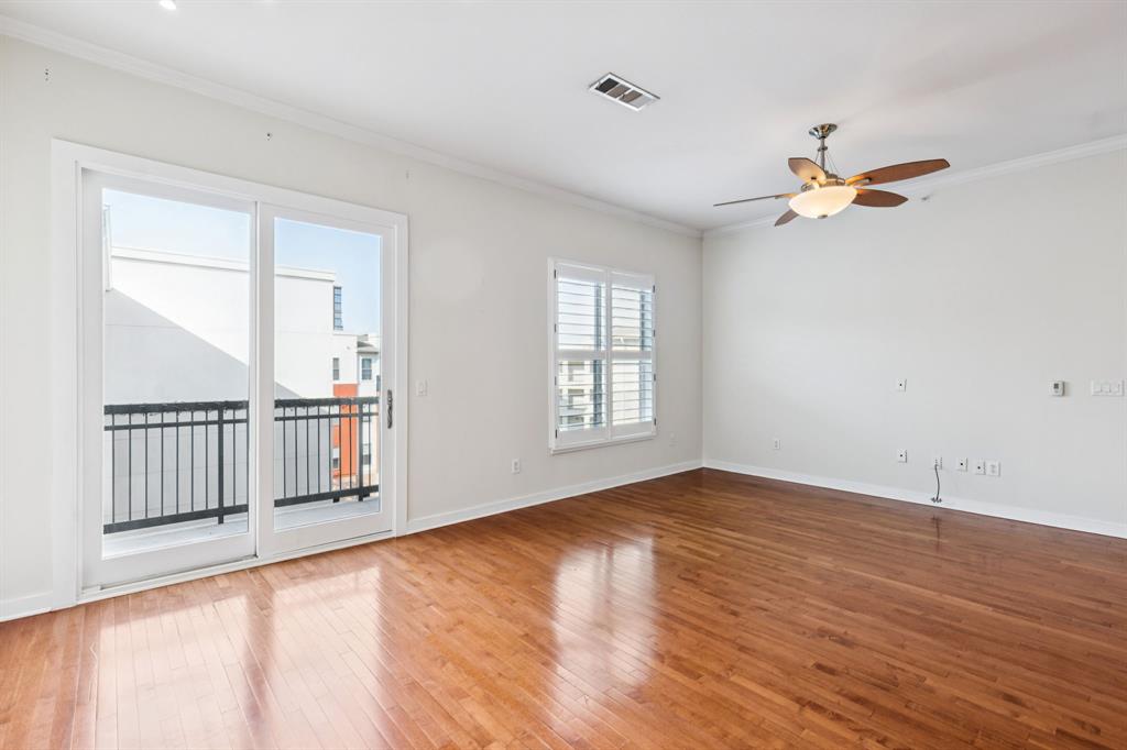 2950 McKinney Avenue, Unit 424 Dallas, TX 75204 - Photo 5 of 25 wooden floor in an empty room with a window