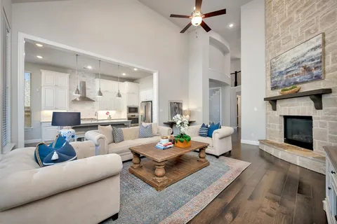a living room with furniture and a fireplace