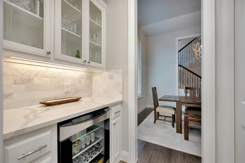 a kitchen with a sink cabinets and a window
