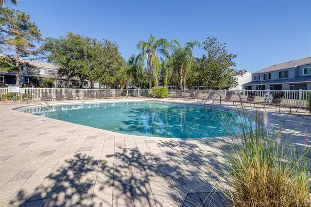 a view of a house with backyard porch and sitting area