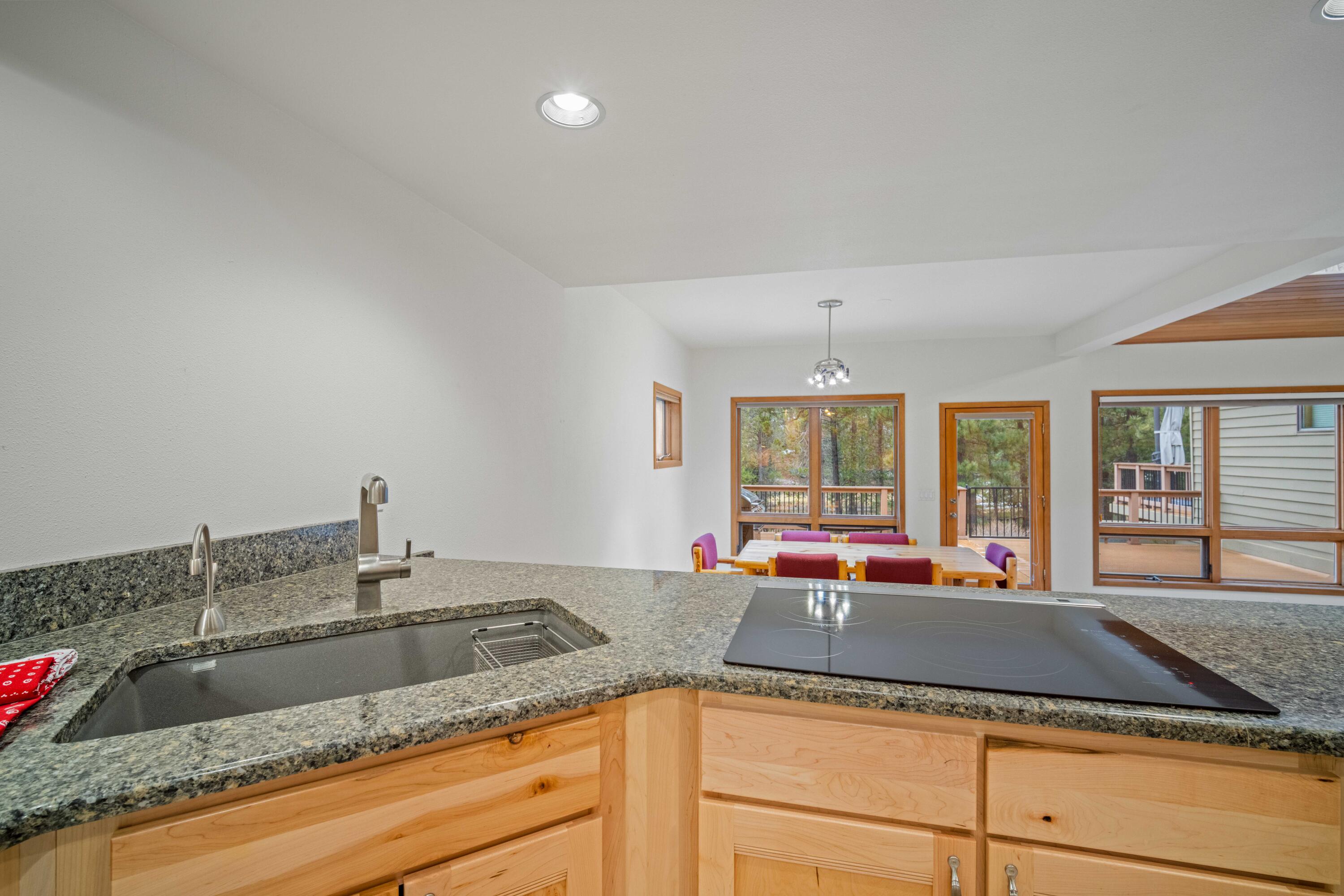 17674 Bittern Lane, Unit 7 Sunriver, OR 97707 - Photo 13 of 43 The view from the kitchen overlooks the forest & river views.