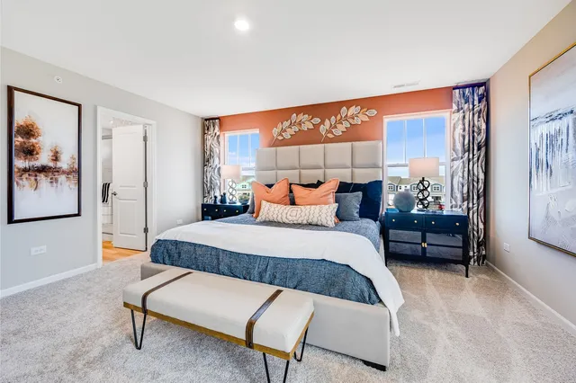 a bedroom with furniture and window