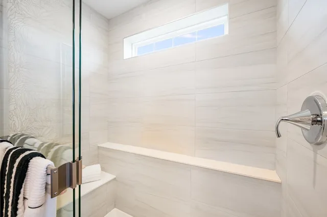 a bathroom with a granite countertop sink a toilet and bathtub