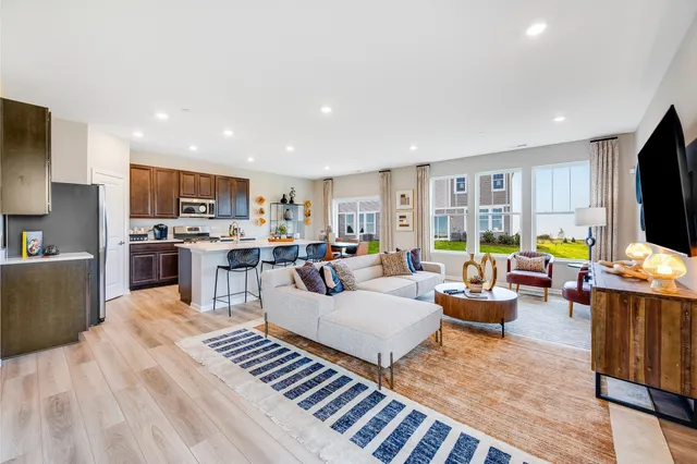 a living room with fireplace furniture and a flat screen tv