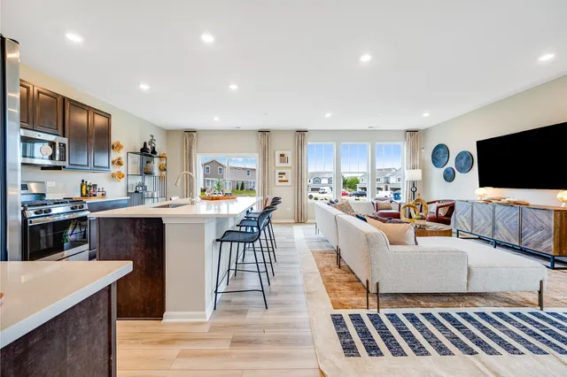a living room with fireplace furniture and a flat screen tv