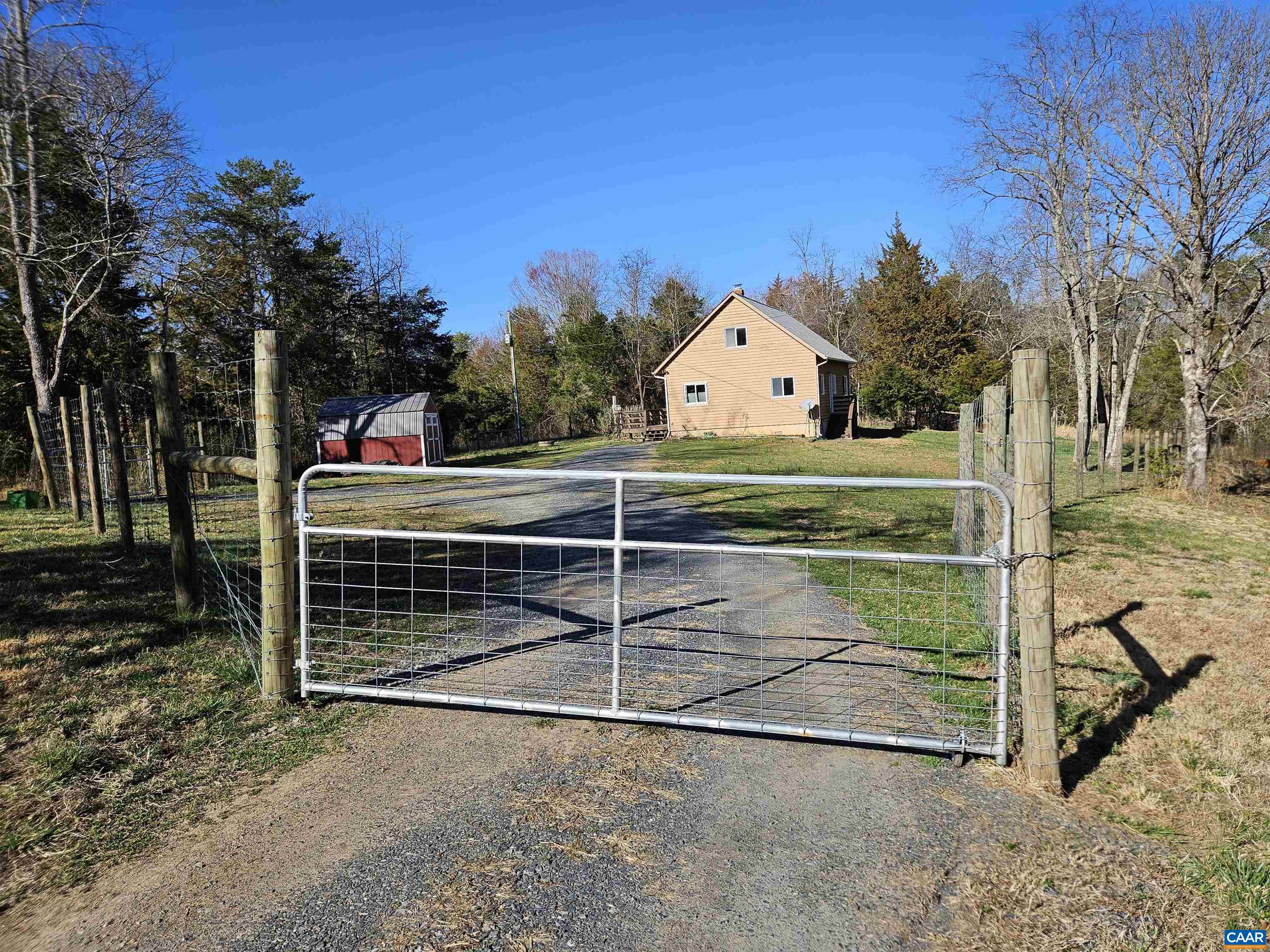 1859 Manteo Road Buckingham, VA 23921 - Photo 2 of 46 a view of backyard with wooden fence and large trees