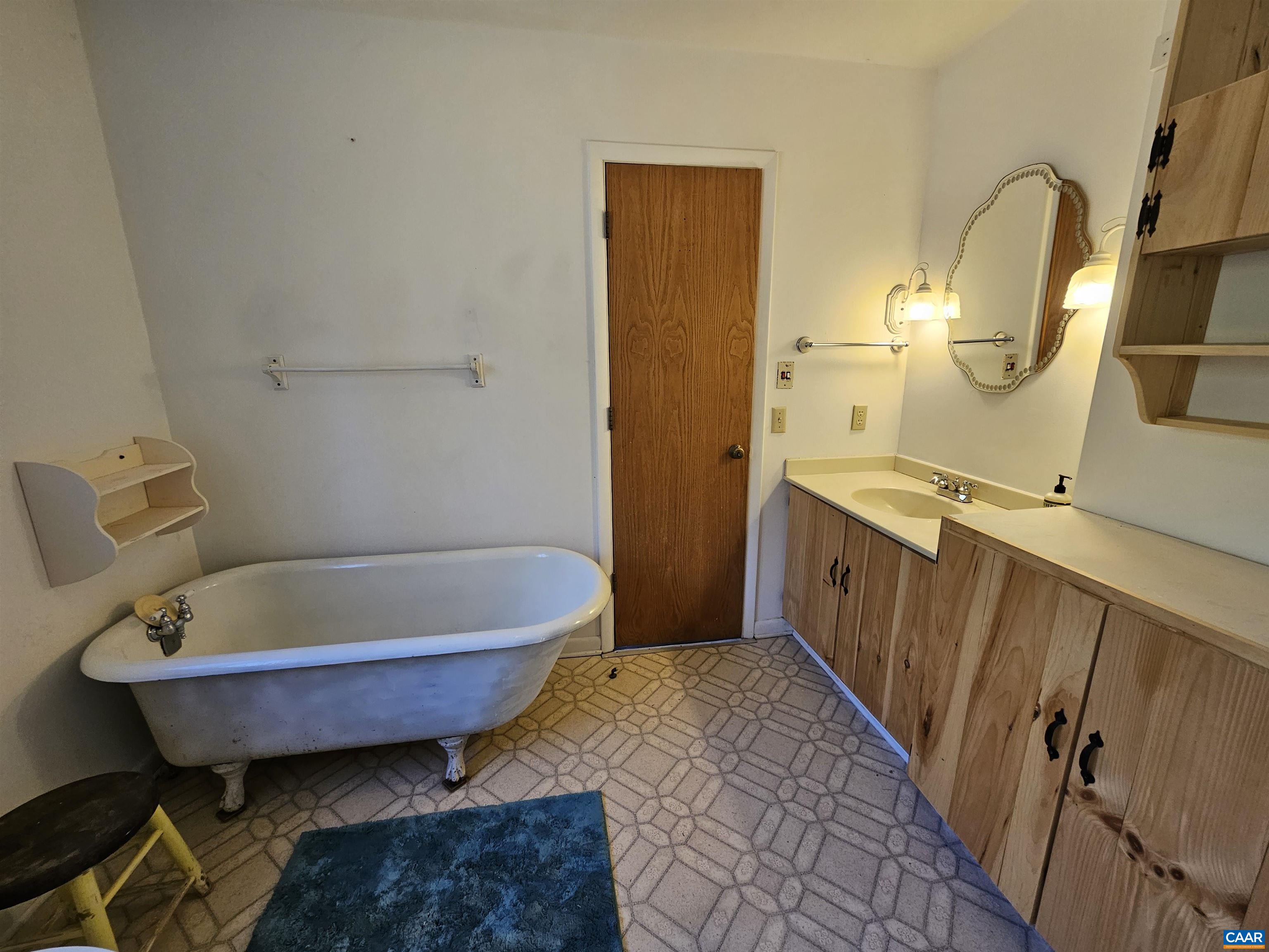 1859 Manteo Road Buckingham, VA 23921 - Photo 26 of 46 a bathroom with a tub sink and mirror