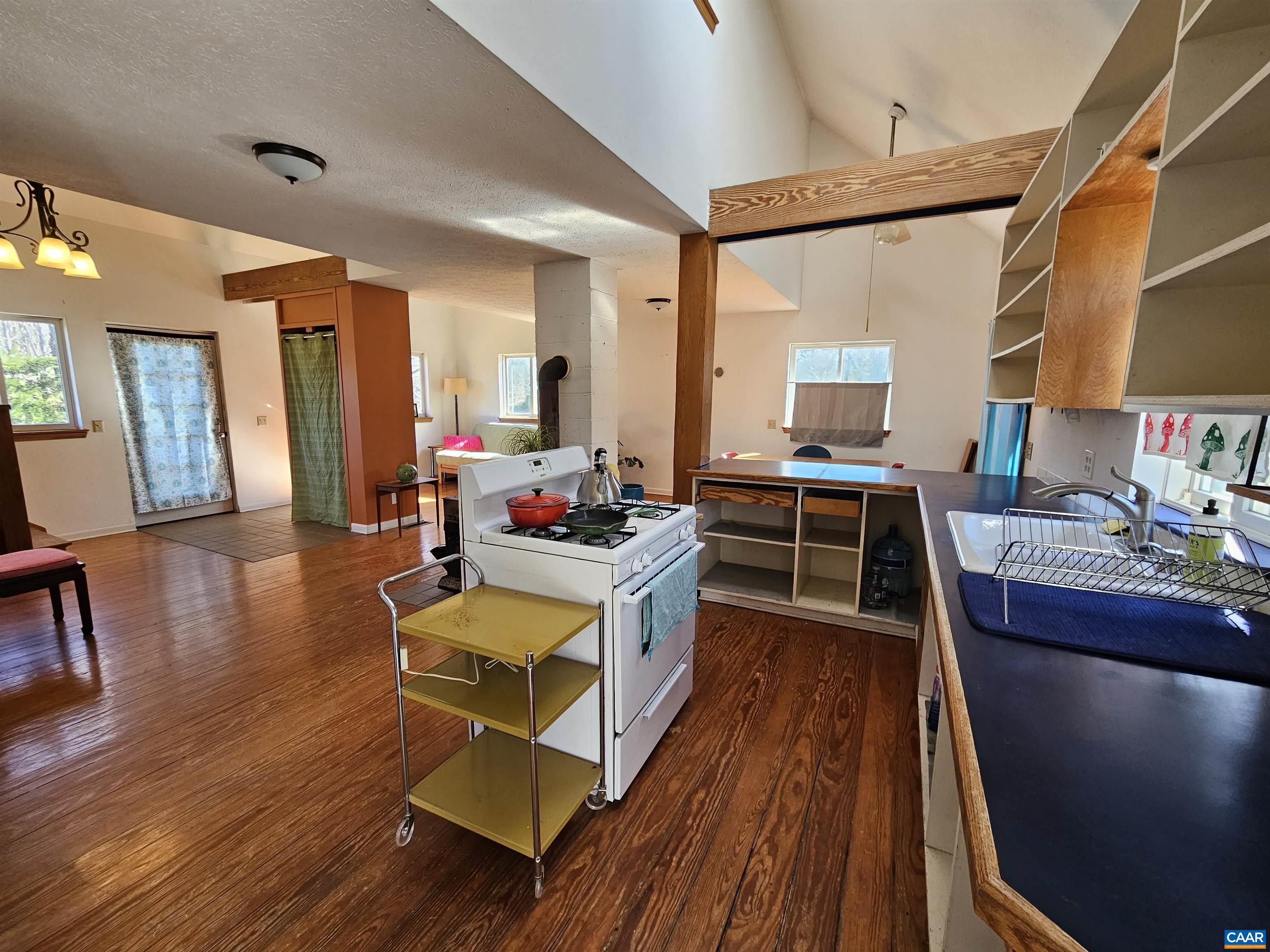 1859 Manteo Road Buckingham, VA 23921 - Photo 29 of 46 a living room with furniture a wooden floor and a sink