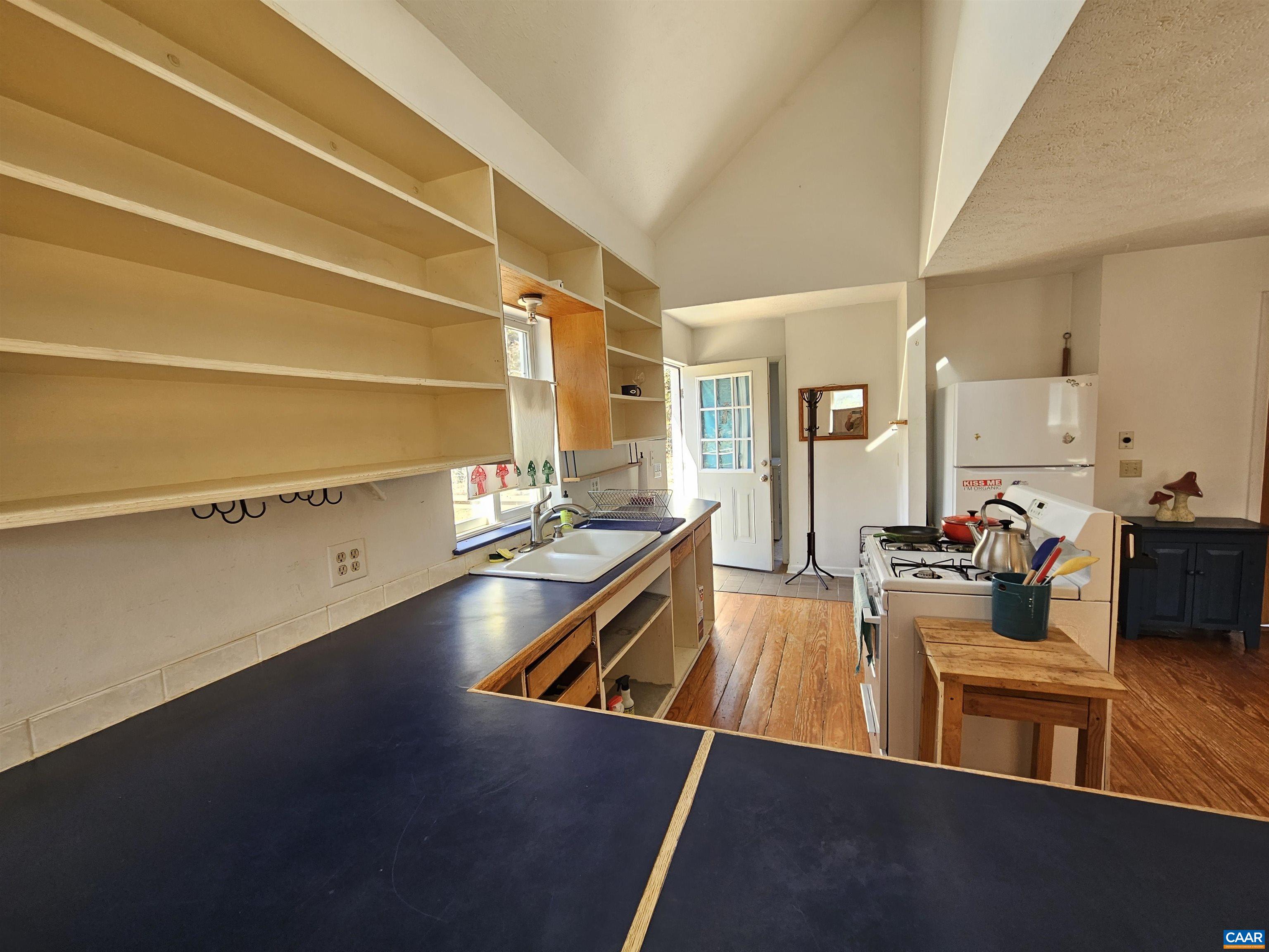 1859 Manteo Road Buckingham, VA 23921 - Photo 31 of 46 a room with lots of furniture and wooden floor