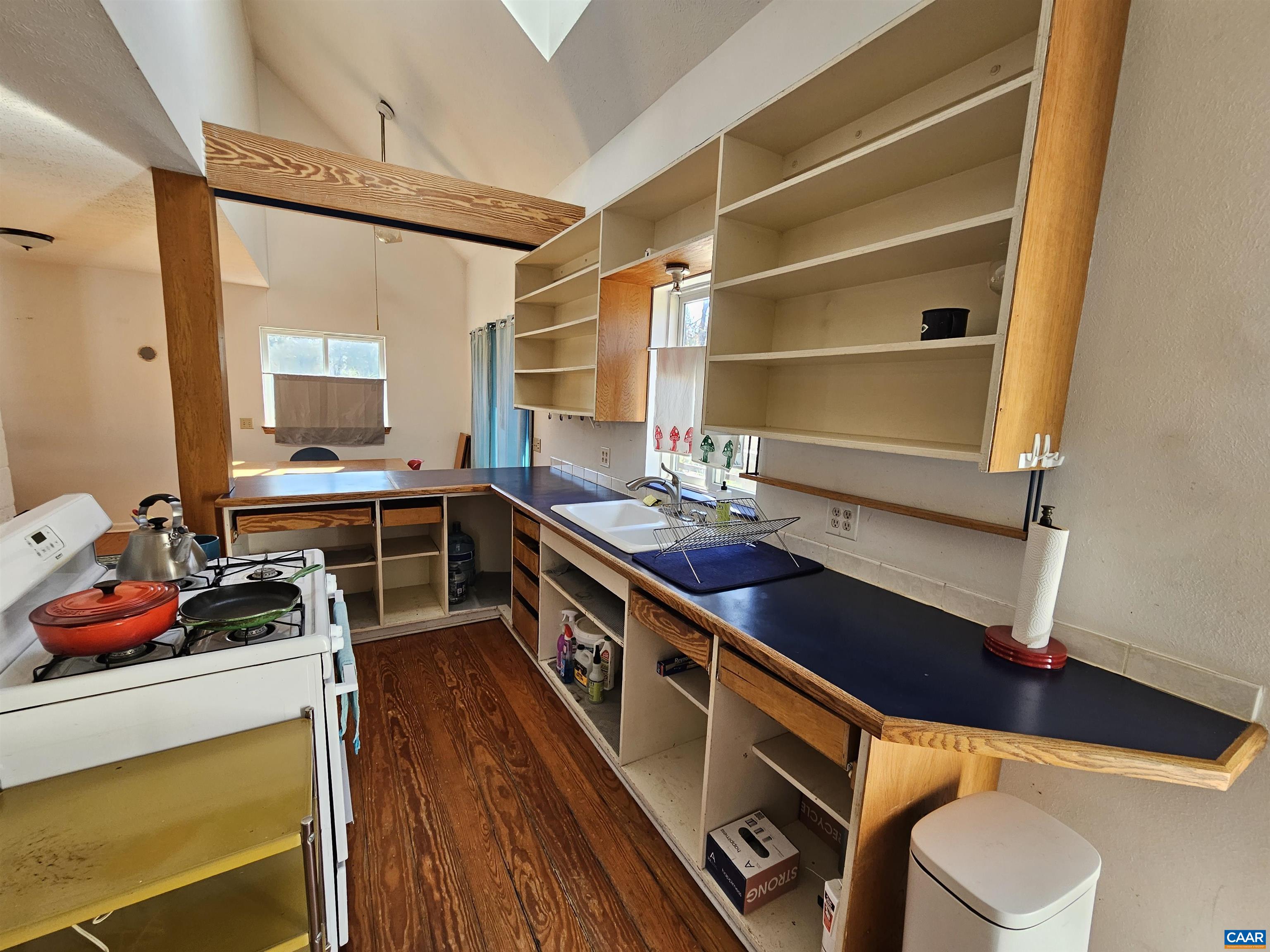1859 Manteo Road Buckingham, VA 23921 - Photo 34 of 46 a kitchen with a sink and wooden cabinets
