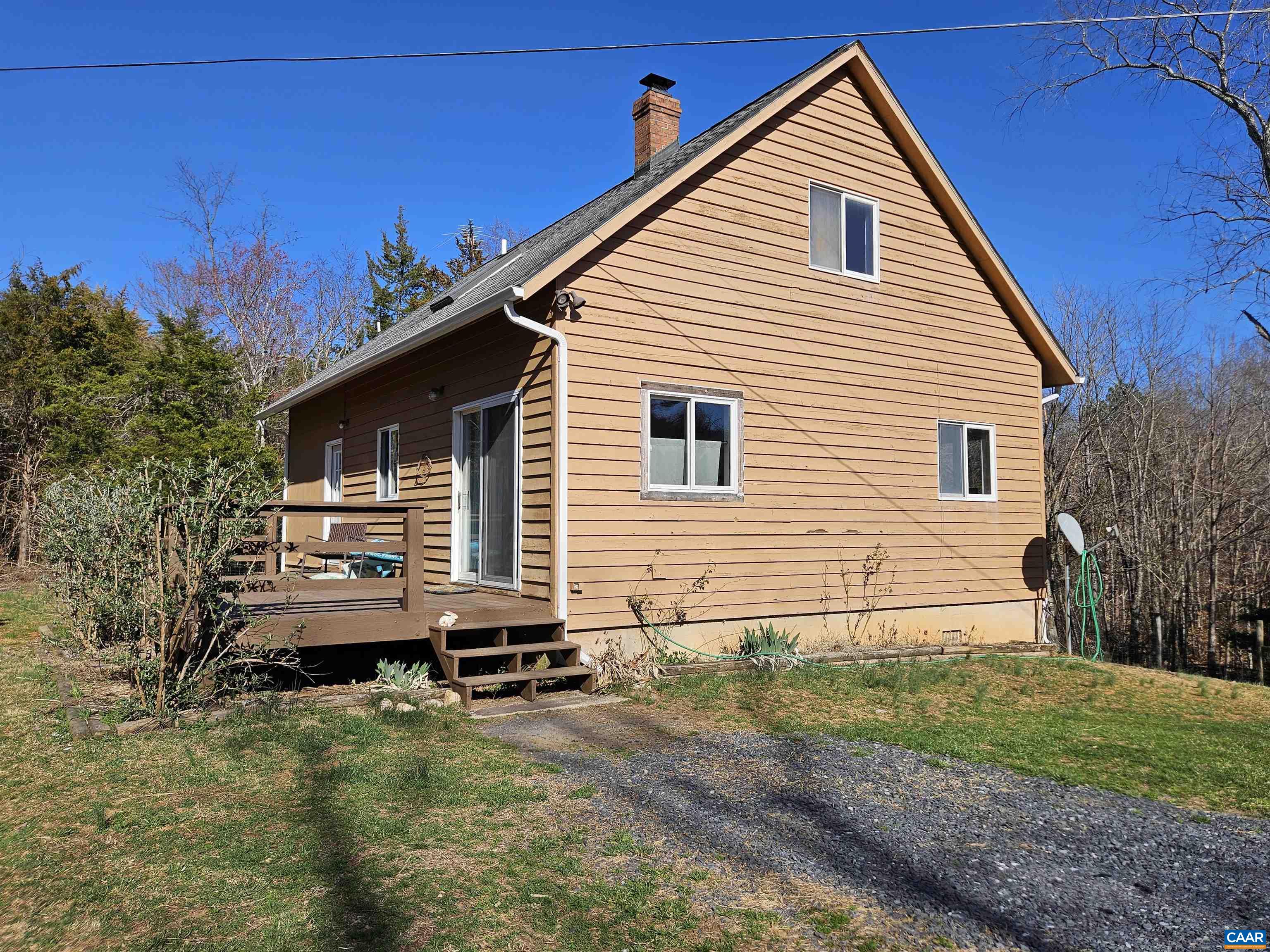 1859 Manteo Road Buckingham, VA 23921 - Photo 37 of 46 a backyard of a house with wooden deck and seating space