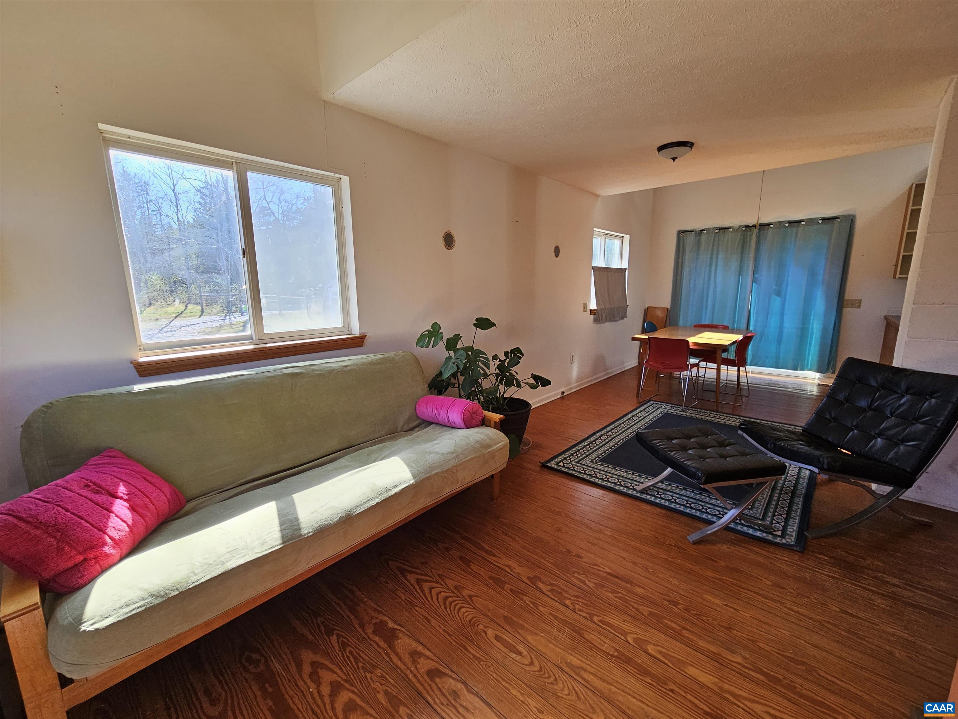 1859 Manteo Road Buckingham, VA 23921 - Photo 6 of 46 a living room with furniture and wooden floor