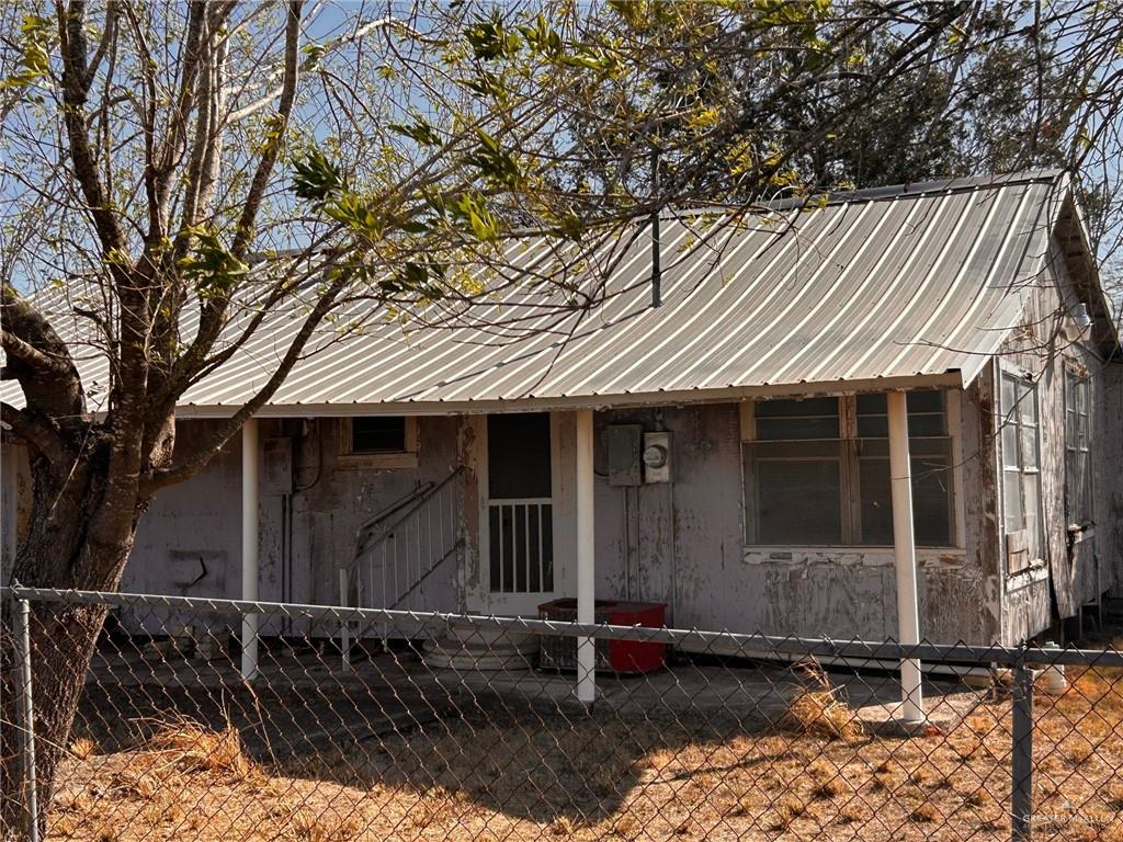 30034 Couch Street Hargill, TX 78549 - Photo 11 of 13 a front view of a house with parking space
