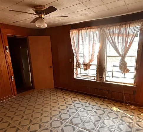 a view of an empty room and window