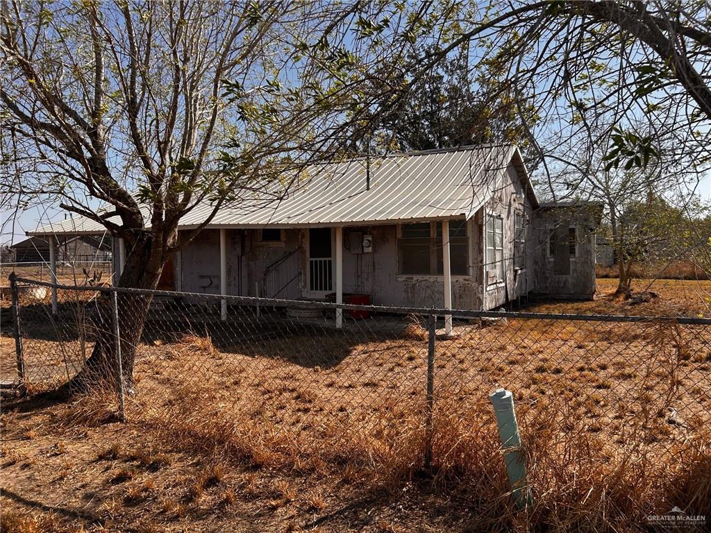 30034 Couch Street Hargill, TX 78549 - Photo 7 of 13 a view of a house with a yard covered in snow