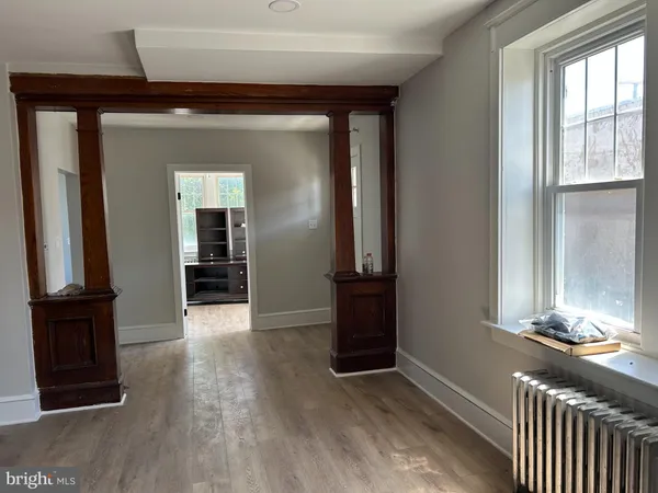 a bathroom with a toilet a sink and a window