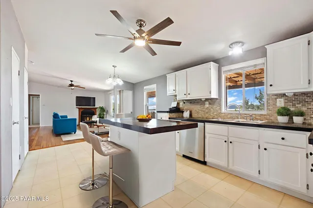 a kitchen with cabinets and window