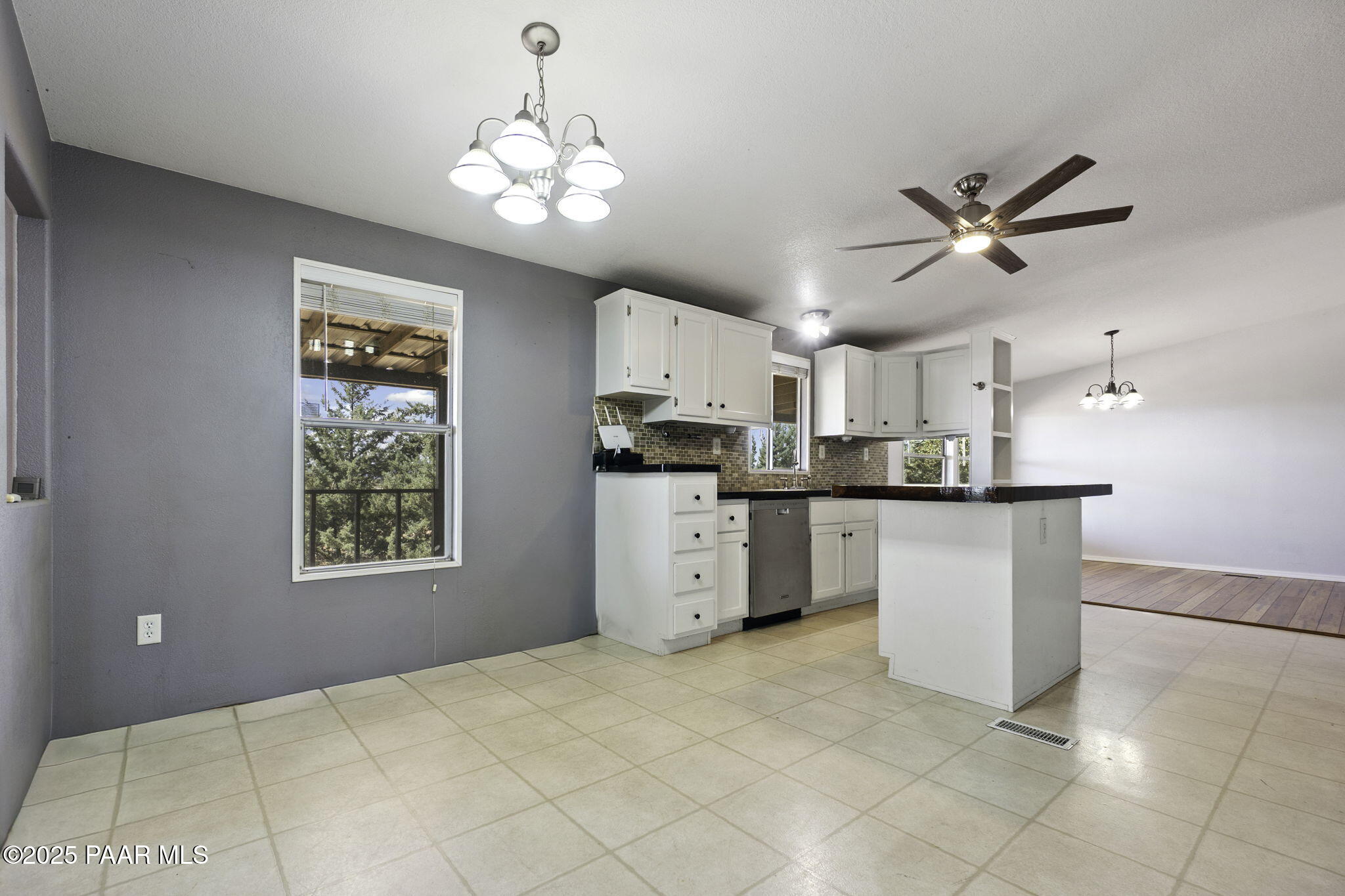 18125 East Roper Way Dewey, AZ 86327 - Photo 16 of 63 a kitchen with cabinets and window